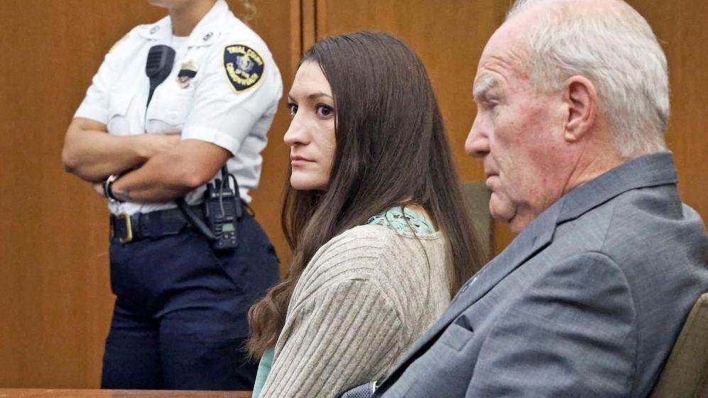 Lindsay Clancy with her lawyer to her right