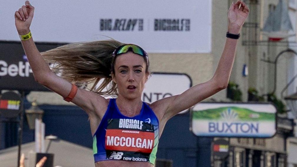 Eilish McColgan crosses the finish line in first place at the Big Half