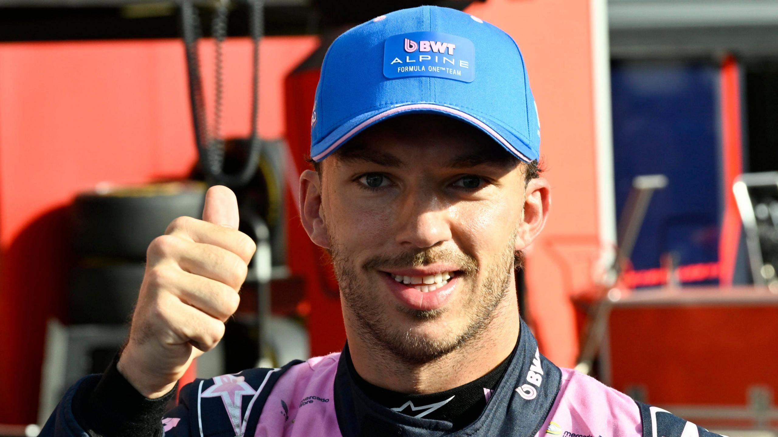 Pierre Gasly gives a thumbs-up at the camera after taking pole position for the Italian Grand Prix