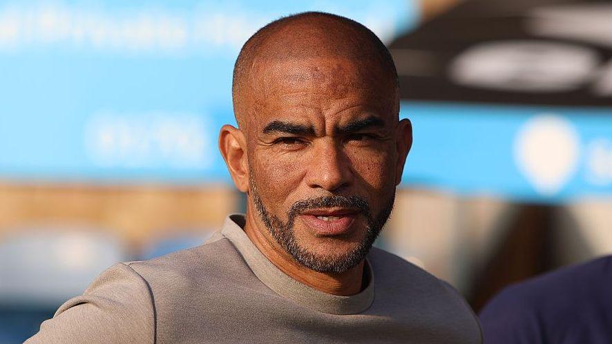 Kieron Dyer in a grey T-shirt on a sunny evening ahead of a Southend United match.