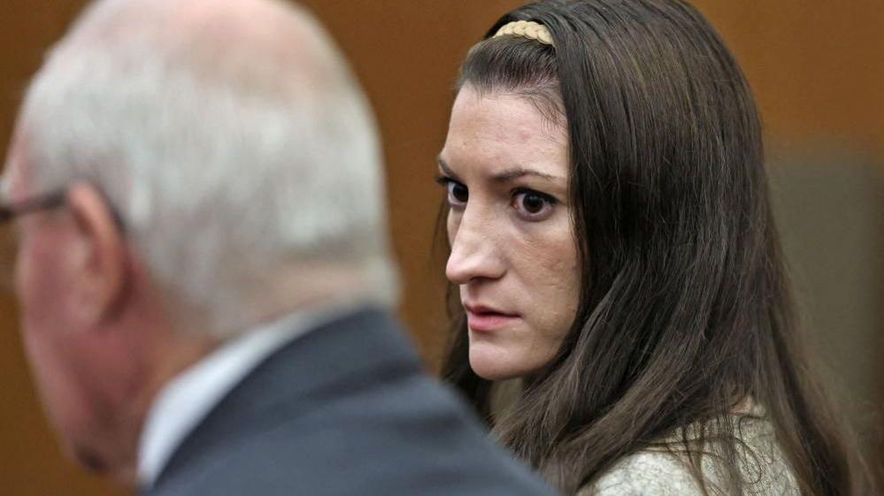 Lindsay Clancy in court next to her lawyer