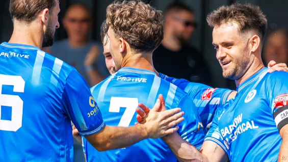 Joe Riley (right) celebrates scoring for Warrington Rylands against FC United of Manchester on 8 August
