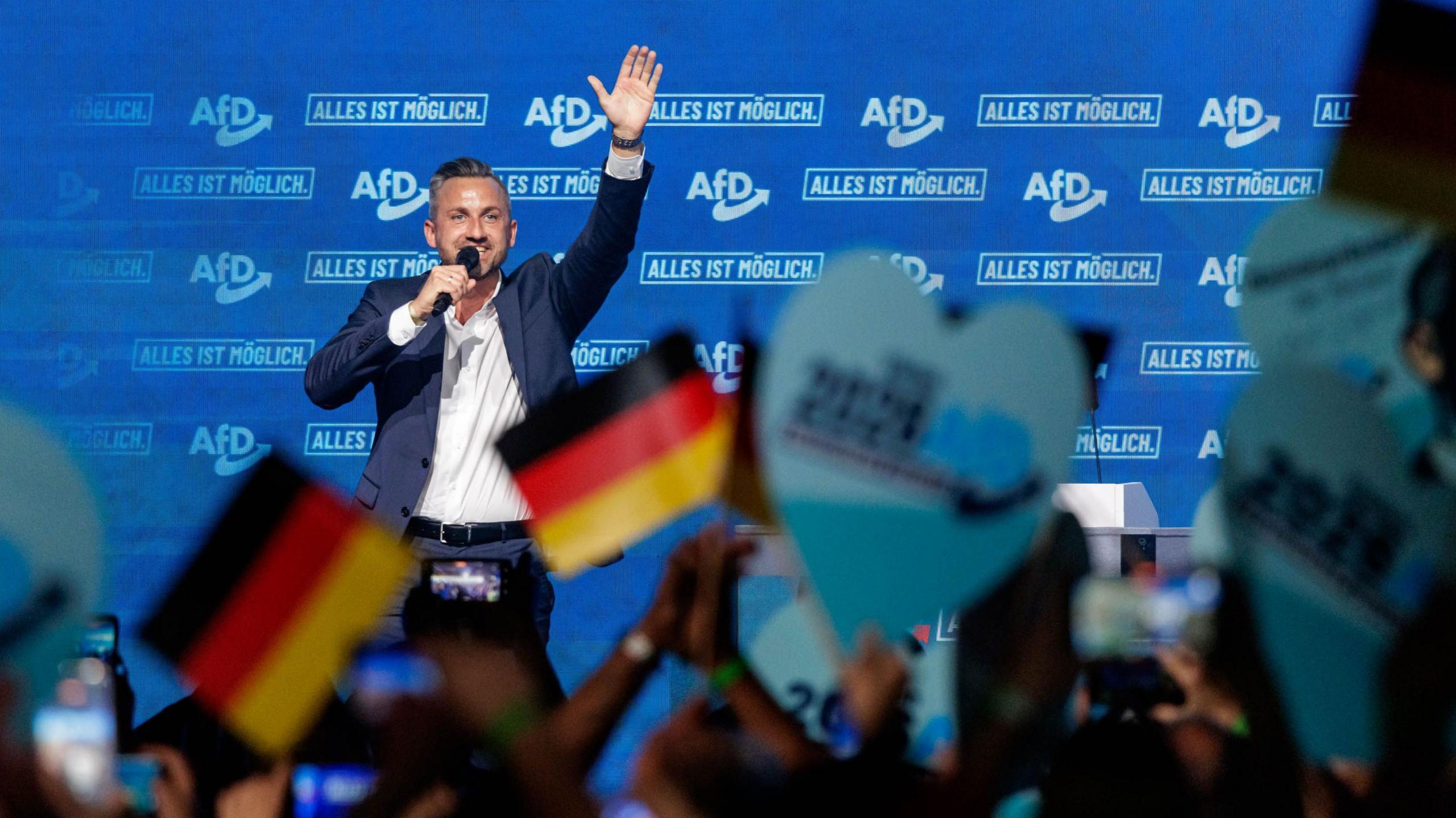 Ulrich Siegmund, lead candidate of the far-right Alternative for Germany (AfD), gestures as he speaks to supporters during an AfD-sponsored outing of Simson motorcycle enthusiasts ahead of upcoming state elections in Saxony-Anhalt on July 26, 2026 in Weissenfels, Germany.