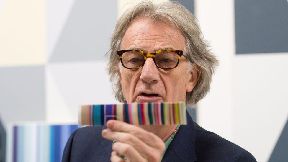 British fashion designer Paul Smith is pictured in a replica of his design studio as he launches an exhibition entitled "Hello, My Name is Paul Smith" at the Design Museum in London, on November 14, 2013