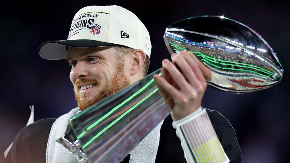 Sam Darnold holds the Lombardi Trophy after the Seattle Seahawks win Super Bowl 60