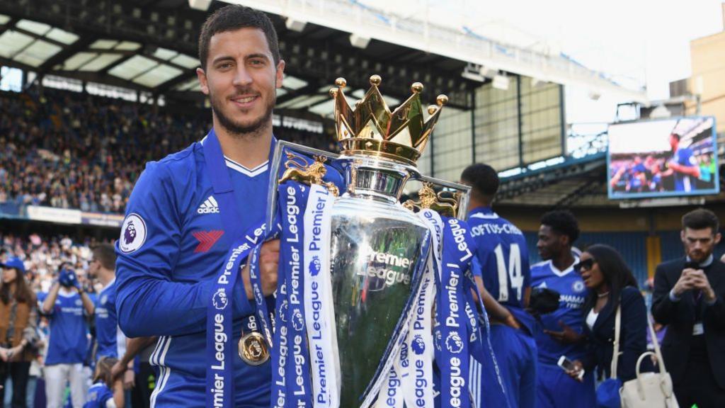 Eden Hazard of Chelsea poses with the Premier League trophy in 2017