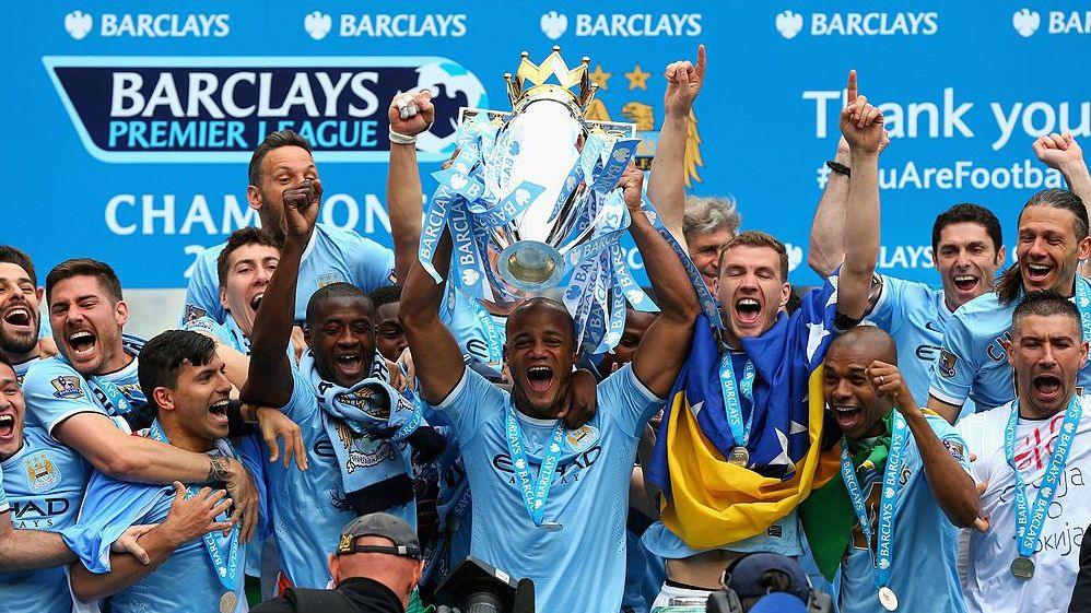 Manchester City players lifting the Premier League trophy in 2014