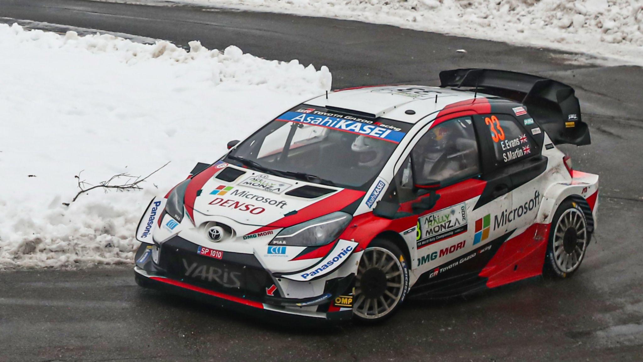 Elfyn Evans Toyota Yaris rounds a bend on a snowy road