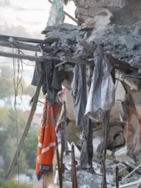 An orange clay Roland Garros towel with the year 2025 seen on it hangs from the wreckage of a damaged multi-storey residential building in Odesa, southern Ukraine, following a Russian aerial attack. Photo: 12 September 2026