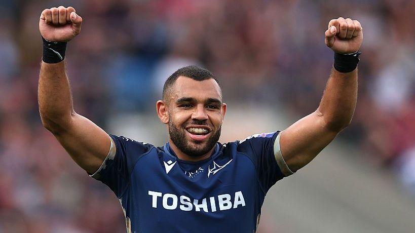 Joe Marchant raises his arms in celebration