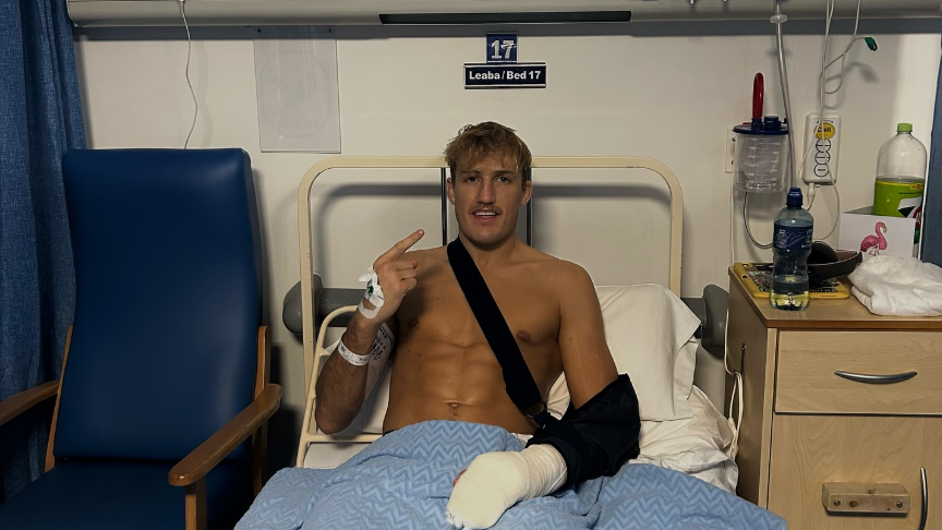 Adam Darby in a hospital bed