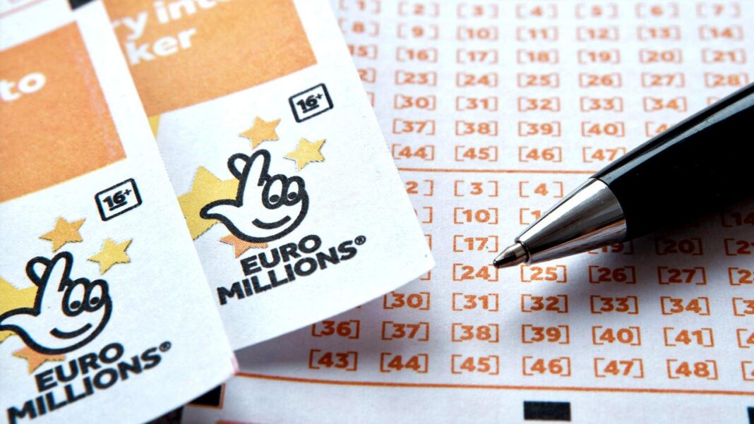 UK ticket holder wins £111m EuroMillions jackpot Two EuroMillions tickets side-by-side, with the National Lottery logo seen at the top of both, beside a ballpoint pen