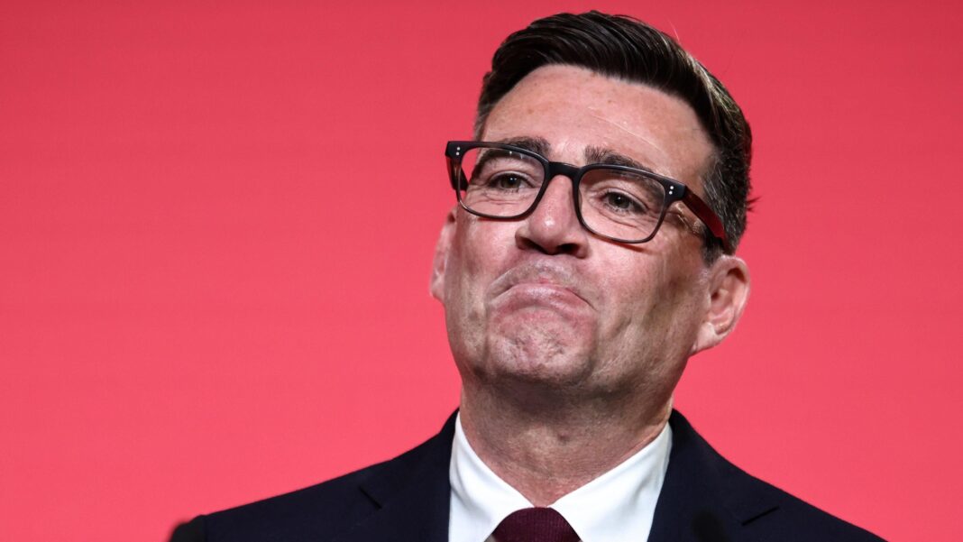 New policies, election speculation: What to expect from Burnham’s first Labour conference as PM Andy Burnham looking pleased as he reacts to becoming Labour leader. He is wearing black rimmed glasses and a dark suit and tie, against a red background.