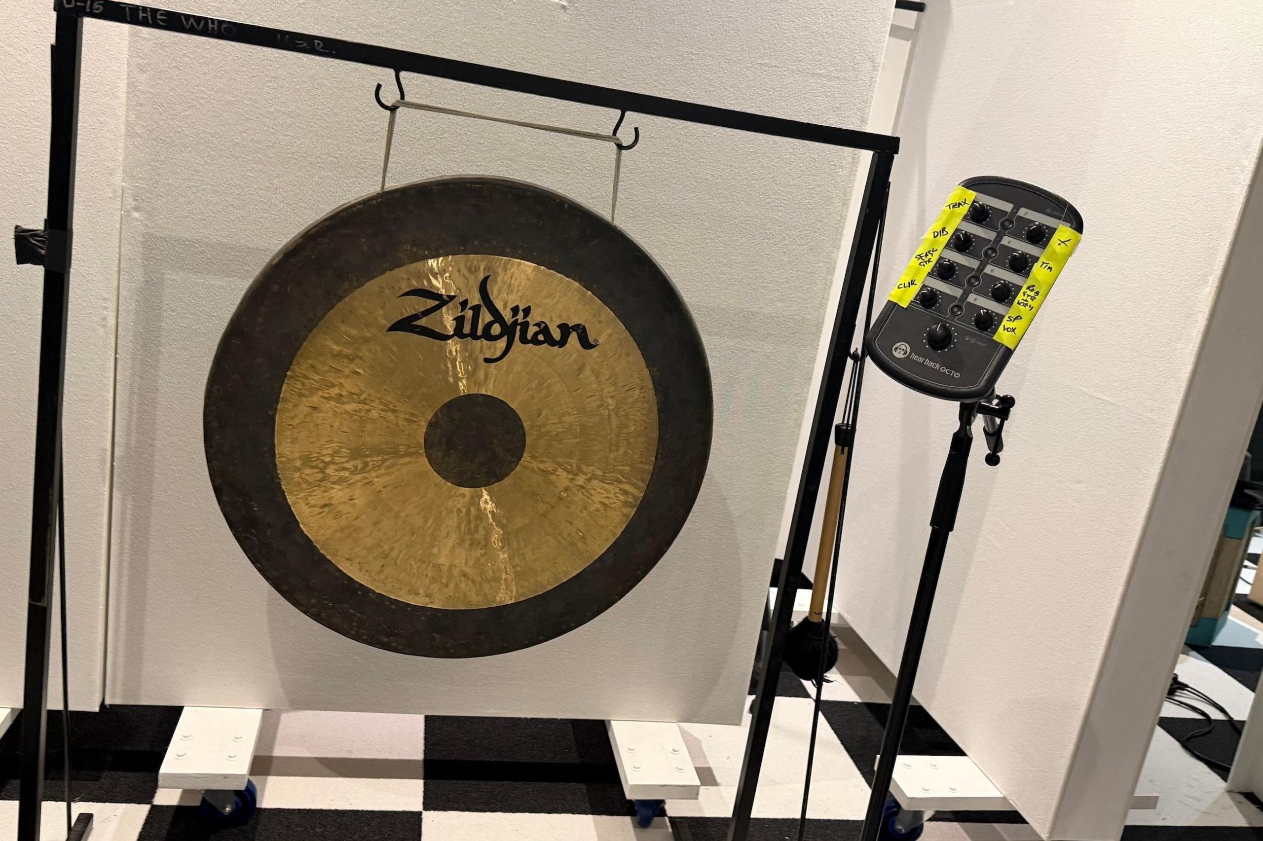 A golden and black gong in the studio