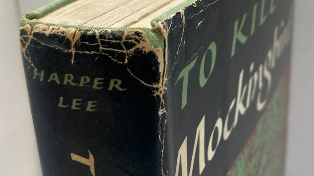 A close-up of the top half of a hardback book