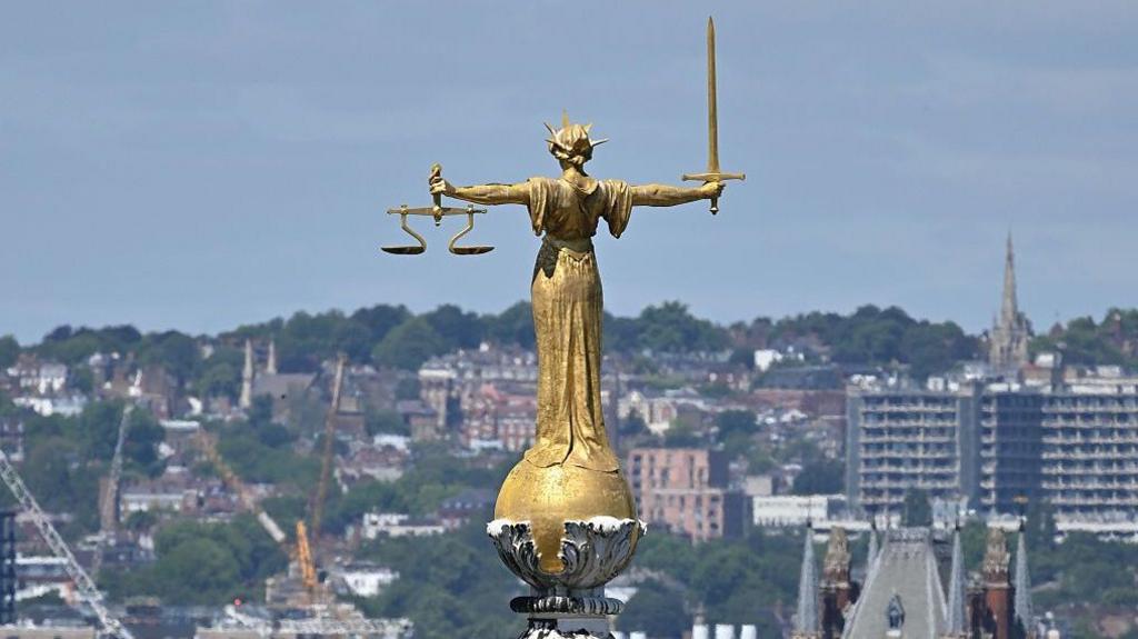 The statue of Lady Justice atop the Old Bailey in London