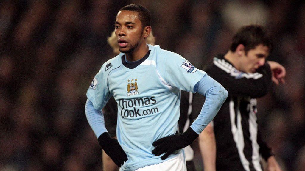 Robinho, playing for Manchester City, with his hands on his hips