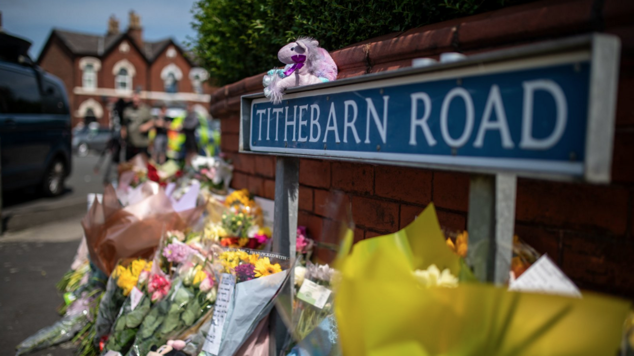 Tributes left under a sign for Tithebarn Road, close to where the Southport attack took place