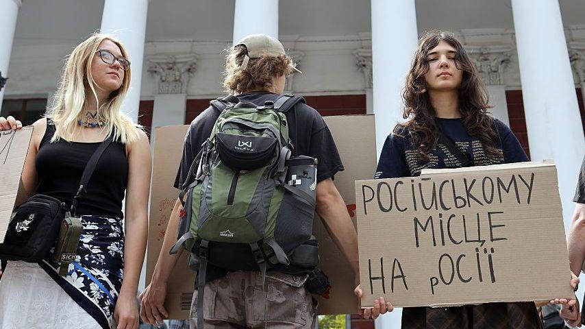 Activists holding placards take part in a rally in support of introducing a moratorium on the public use of Russian-language cultural products on July 8, 2026 in Odesa, Ukraine