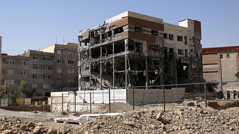 General view of a five-storey building in Tehran. The building has been shelled-out by a reported missile attack, the outer brickwork is no longer visible and instead the building is hollowed out but is still standing. It is surrounded by rubble