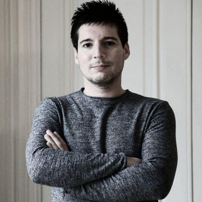 Rui Pinto stands with his arms folded
