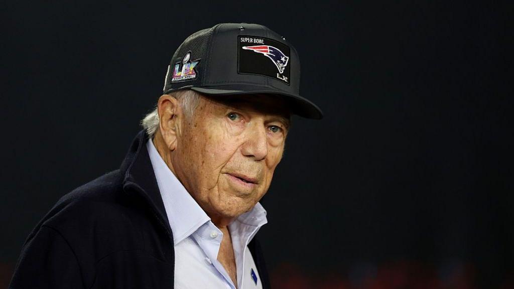New England Patriots owner Robert Kraft wears a Patriots hat and looks on during Super Bowl LX Opening Night at San Jose McEnery Convention Center on 2 February 2026 in San Jose, California.
