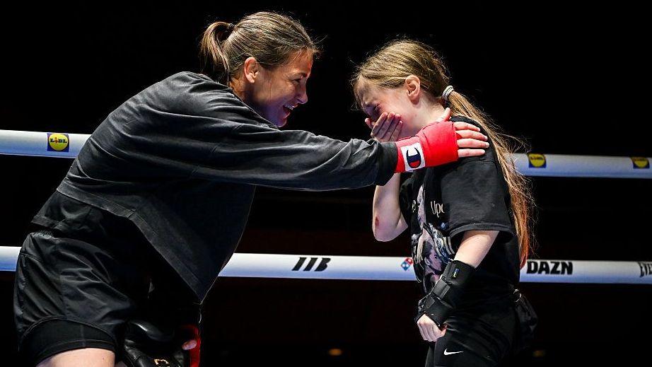 Katie Taylor consoles young fan who is overwhelmed at meeting her