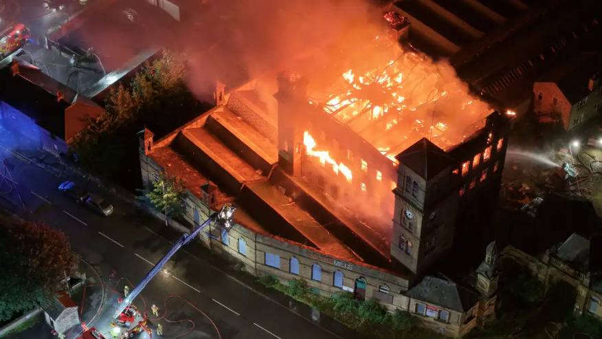 An old mill on fire