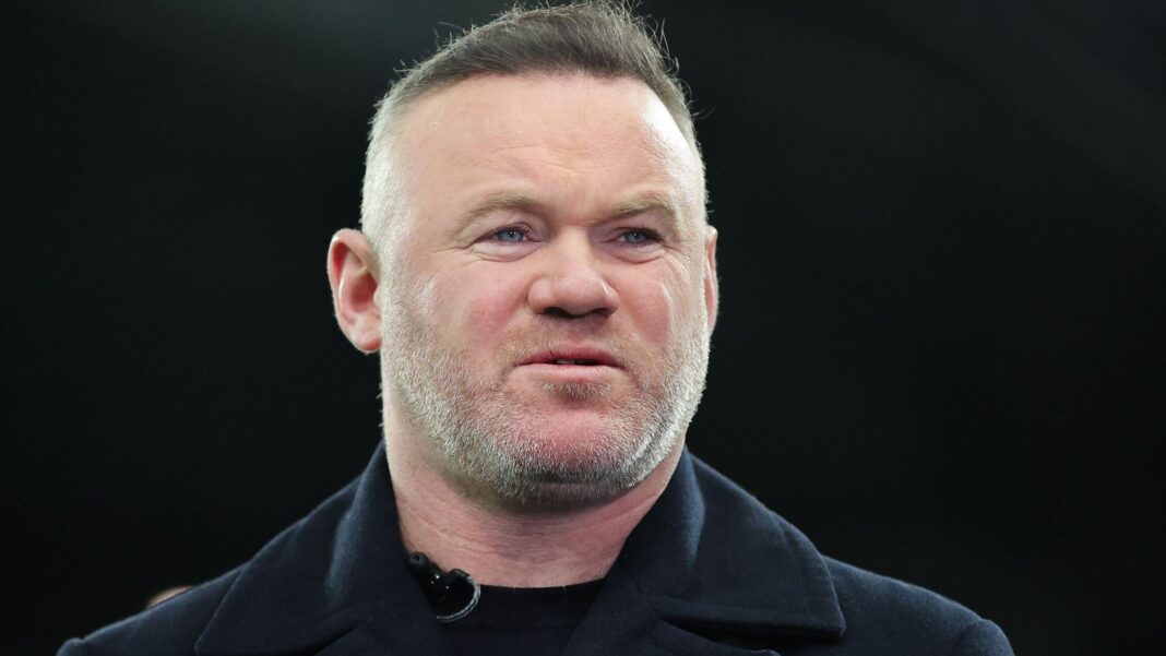 Former Manchester United striker Wayne Rooney looks on