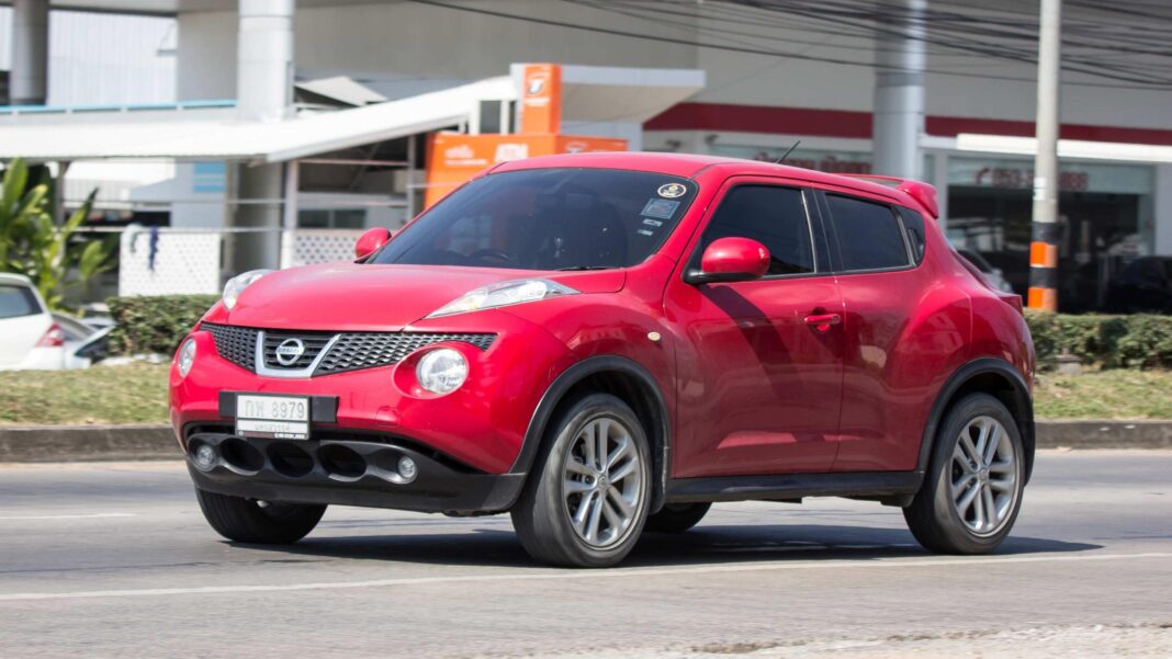 Car thieves target Nissan Jukes as 11 stolen in one county in 24 hours A bright red Nissan Juke on a road. There is a white office building behind it, on the side of the road.