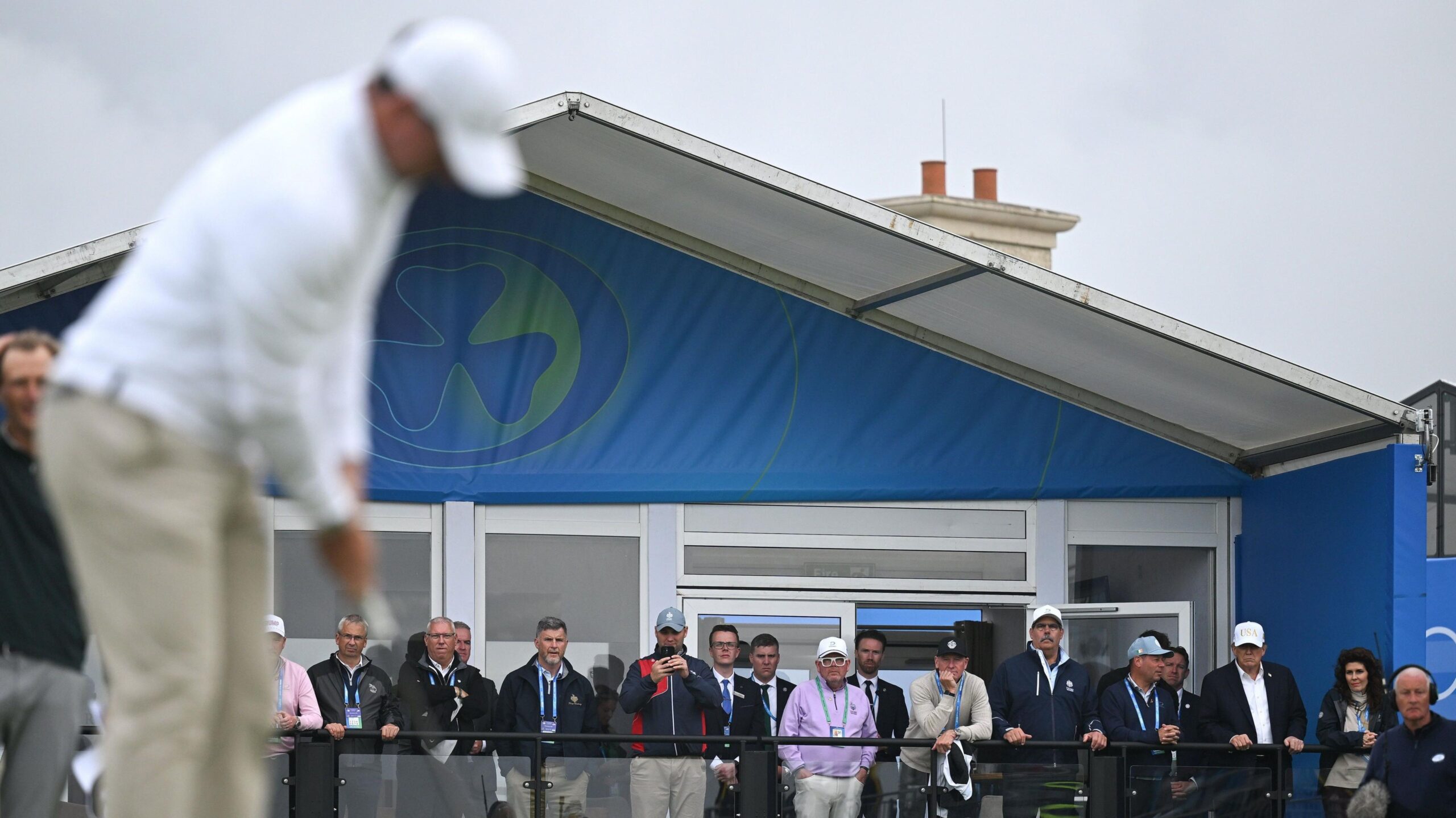 US President Donald Trump watches Rory Mcilroy
