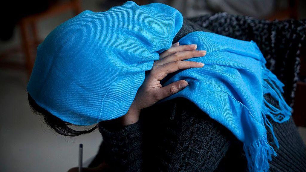 An Afghan female student attends Kabul university on July 6, 2010 in Kabul, Afghanistan.