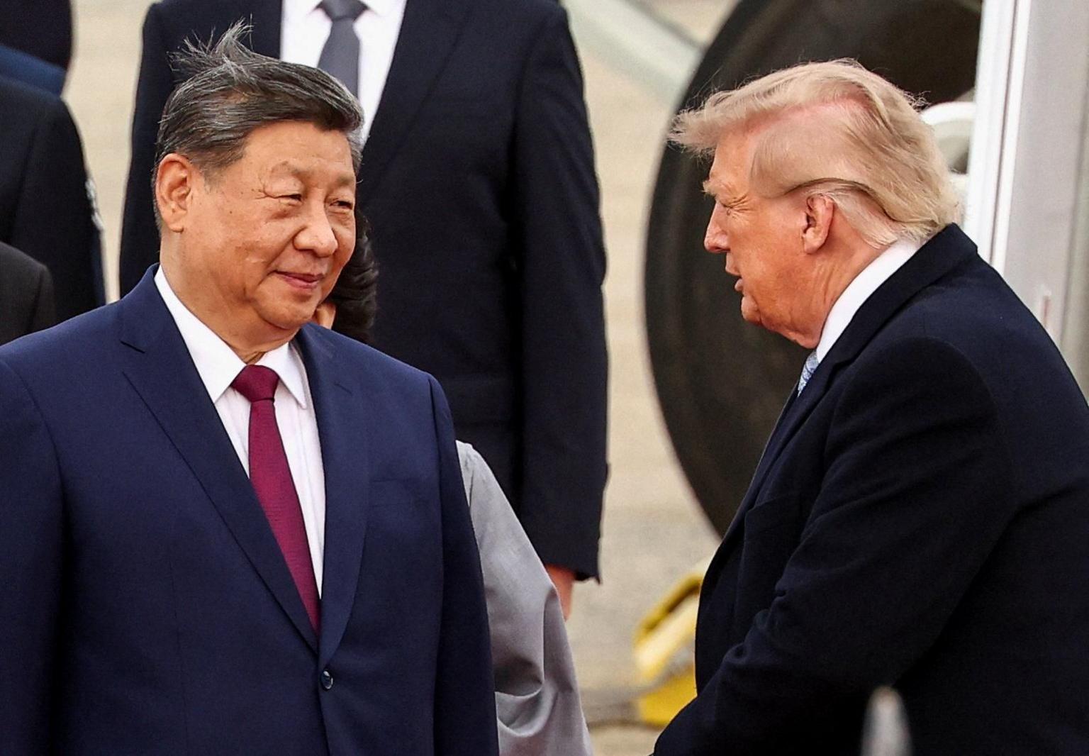 US President Donald Trump greets China's President Xi Jinping upon his arrival at Joint Base Andrews, Maryland, US, September 23, 2026.