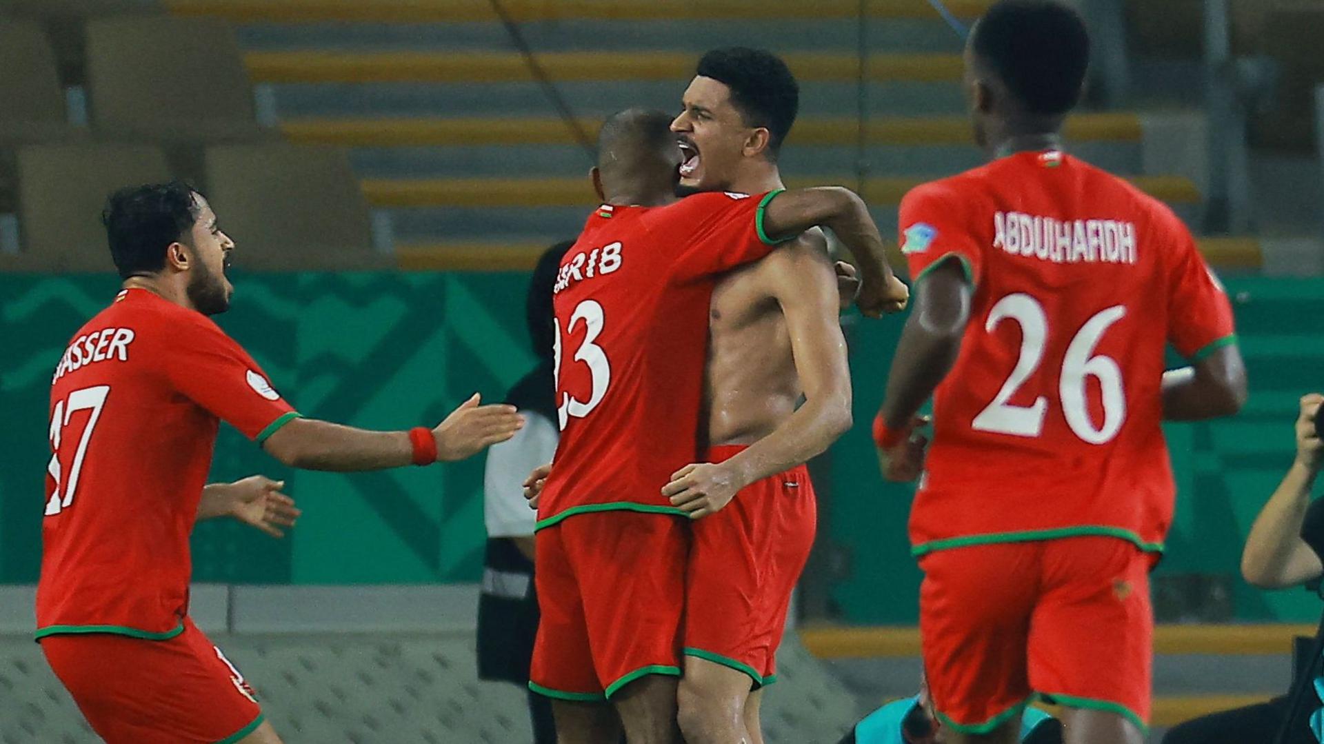 Musab Al-Shaqsy celebrates scoring Oman's third goal in a win against Kuwait