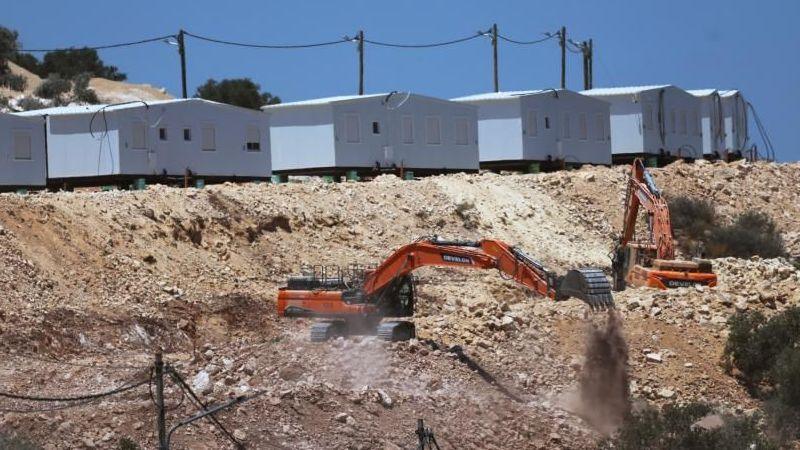 Israeli bulldozers near a new settlement in the West Bank