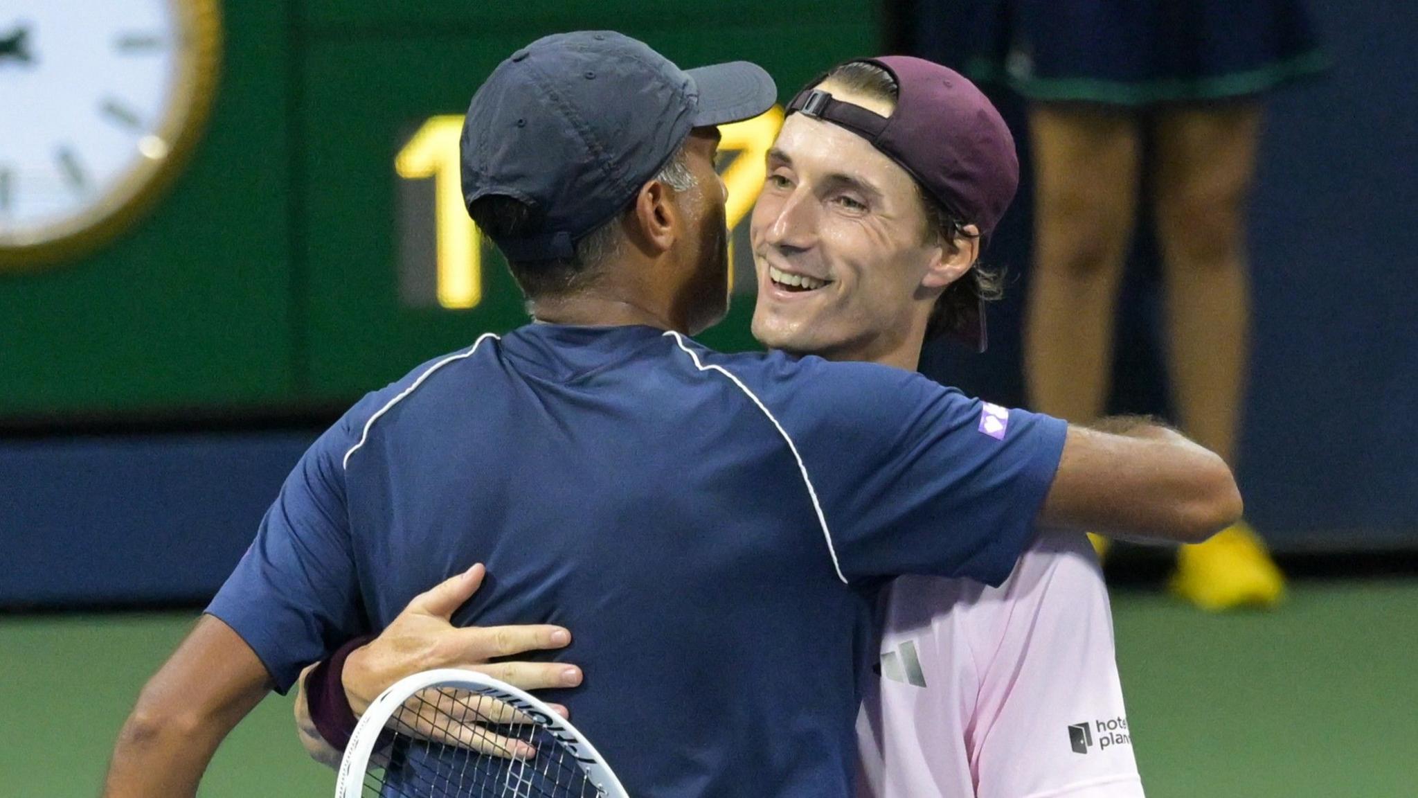 Joe Salisbury (right) hugs doubles partner Rajeev Ram