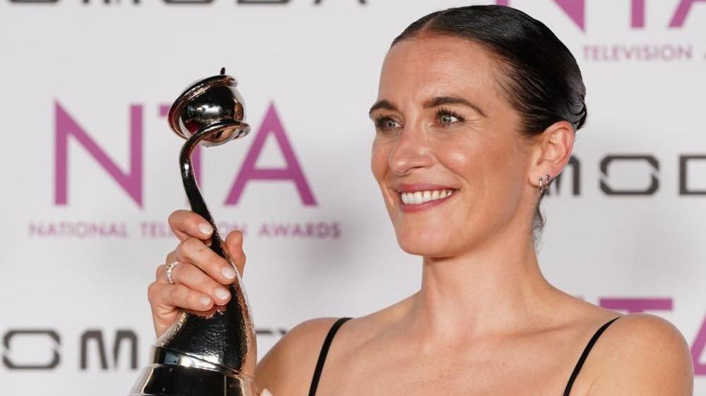 Vicky McClure holding an award