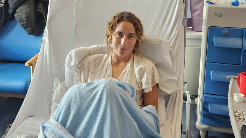Jackie Bachteler sitting up in a hospital bed