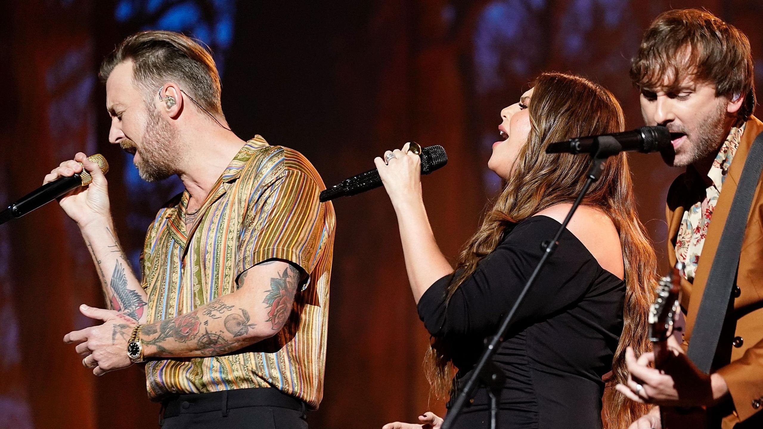 (Left to right) Charles Kelley, Hillary Scott and Dave Haywood of Lady A, performing during the 2024 People's Choice Country Awards at The Grand Ole Opry in Nashville