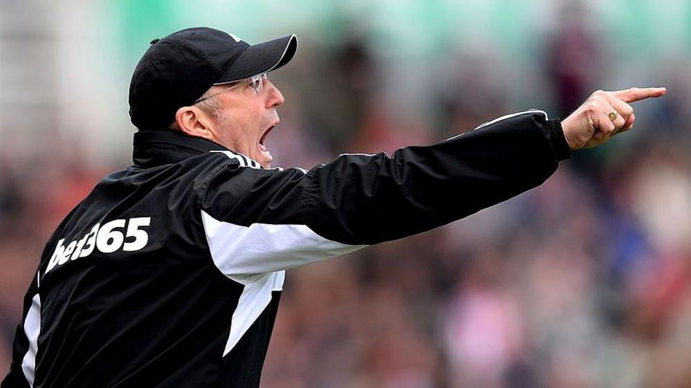 Tony Pulis shouting instructions to his players while managing Stoke City