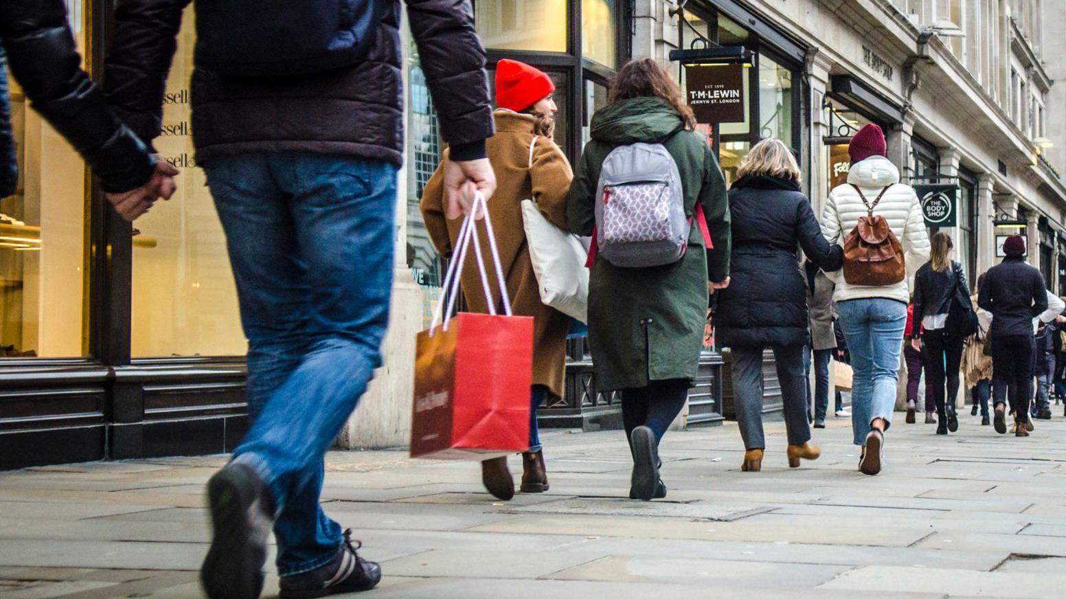 A general view of shoppers walking down a London street