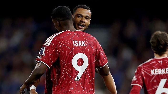 Cody Gakpo and Alexander Isak celebrate after the combined for the Swede to score Liverpool's second goal in their 2-0 win at Ipswich Town.