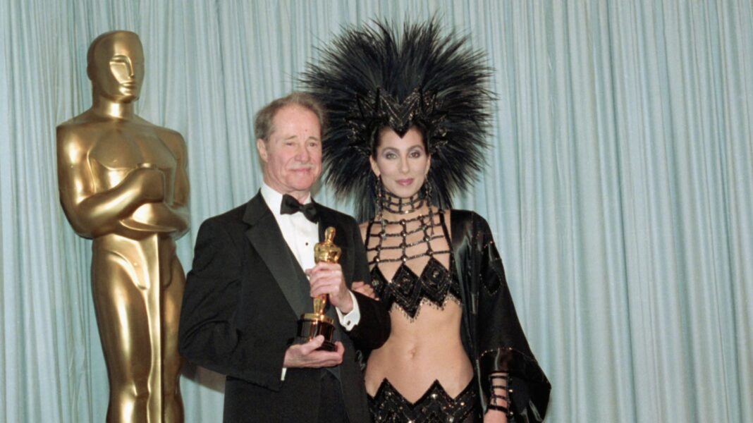 Cher in a feather headdress, 1986.