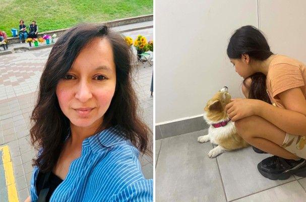 Two photos are side by side. In the left hand one, a woman wearing a blue and white striped shirt takes a selfie of herself. She is half smiling and has long dark hair. In the background is grass and an area like a park. The right-hand side photo is of a child who is squatting down and petting a brown and white dog. The girl has her back to the camera. She also has long dark hair and is wearing a peach top, shorts and black trainers.