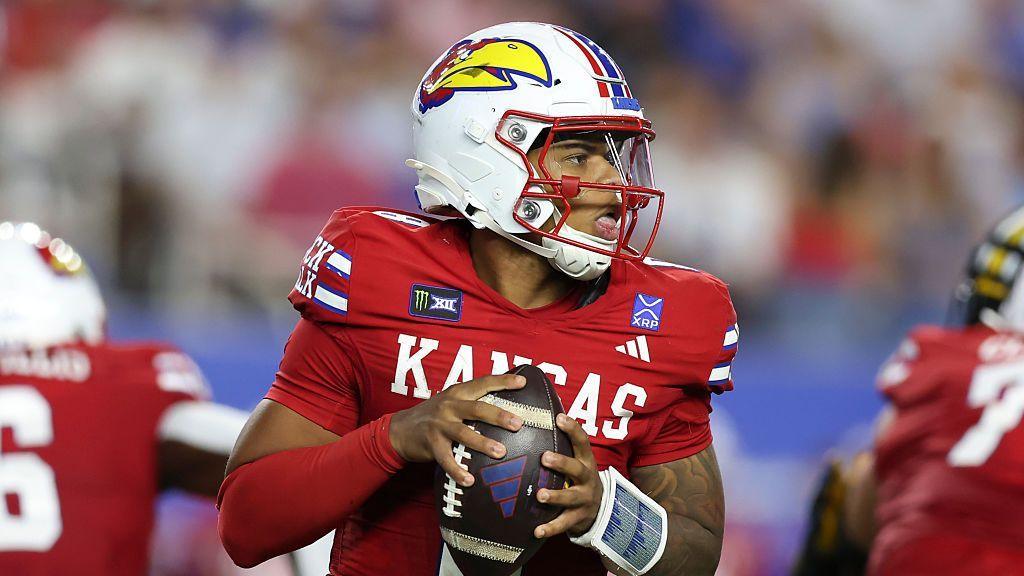 Isaiah Marshall of the Kansas Jayhawks preparing to throw the ball