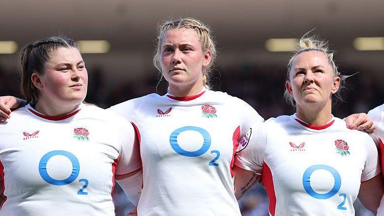Delaney Burns (centre) lines up for England alongside Maud Muir (left) and Marlie Packer (right)