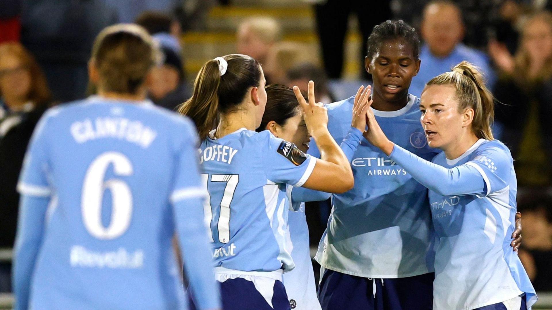Lauren Hemp and Manchester City celebrate scoring against Liverpool in the WSL
