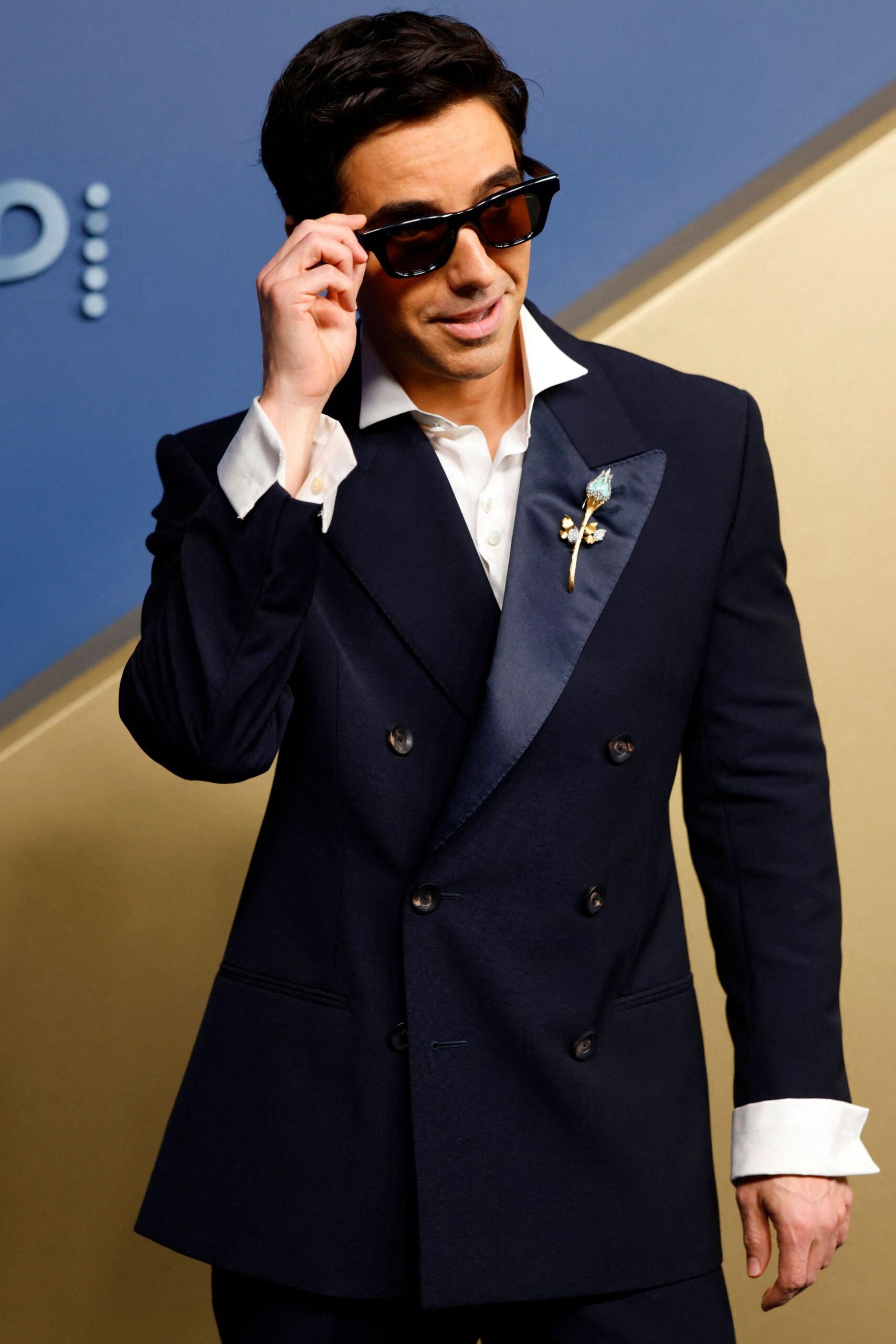 Paul W Downs in a black suit and dark glasses