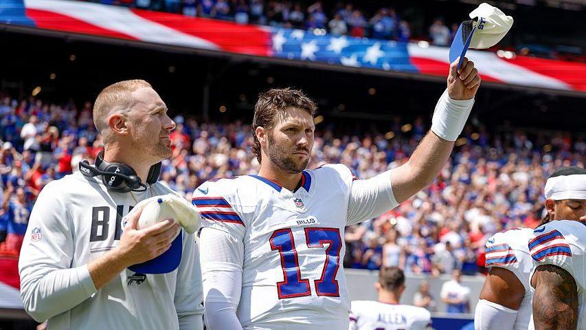 Head coach Joe Brady and quarterback Josh Allen stand for the national anthem before the Buffalo Bills' pre-season game against the Carolina Panthers in August 2026