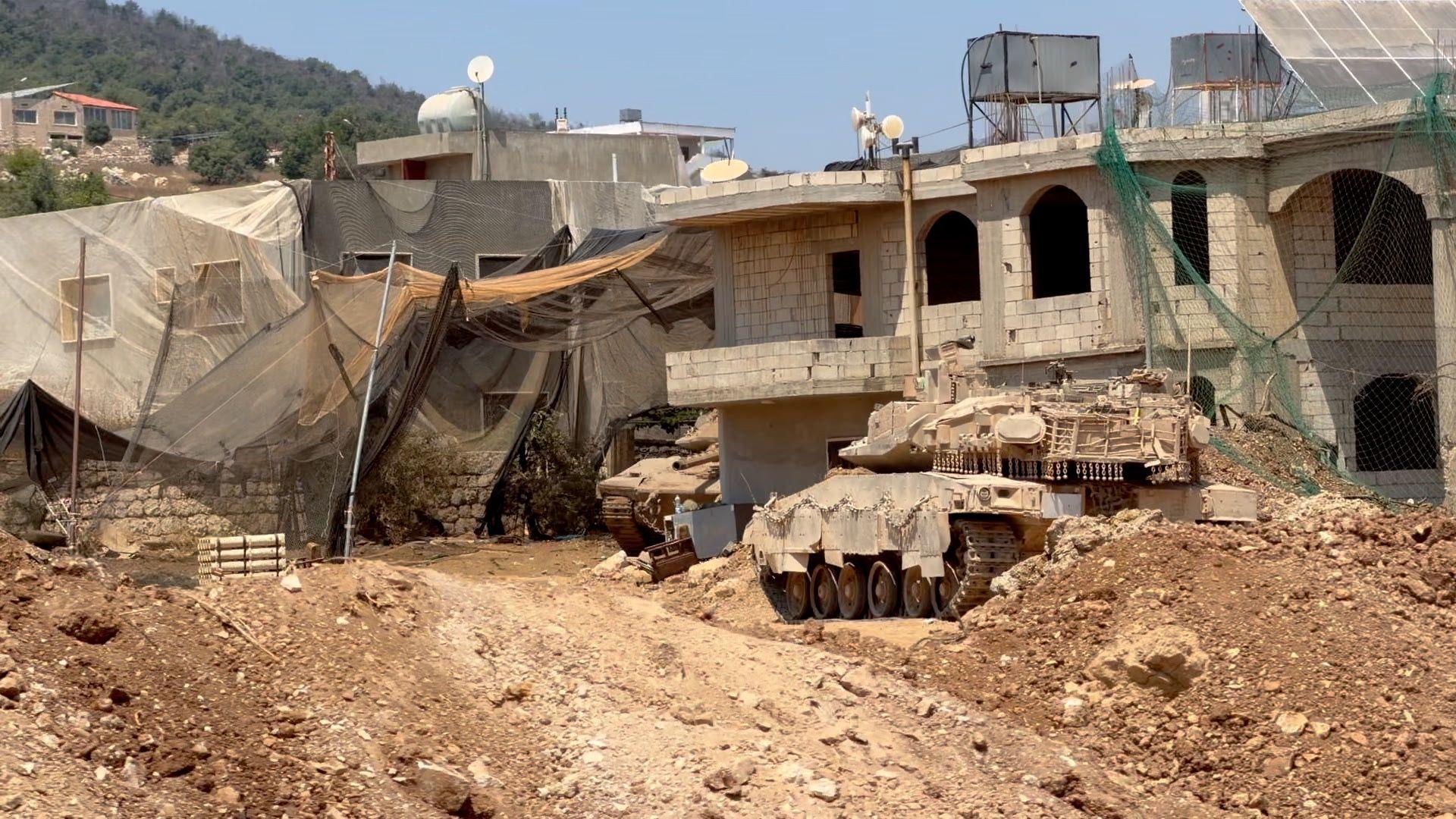 Nets are seen hanging above buildings used by the Israeli military in southern Lebanon
